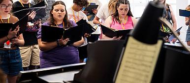 Students singing in a chorus.